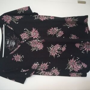 Blacktop with purple flowers